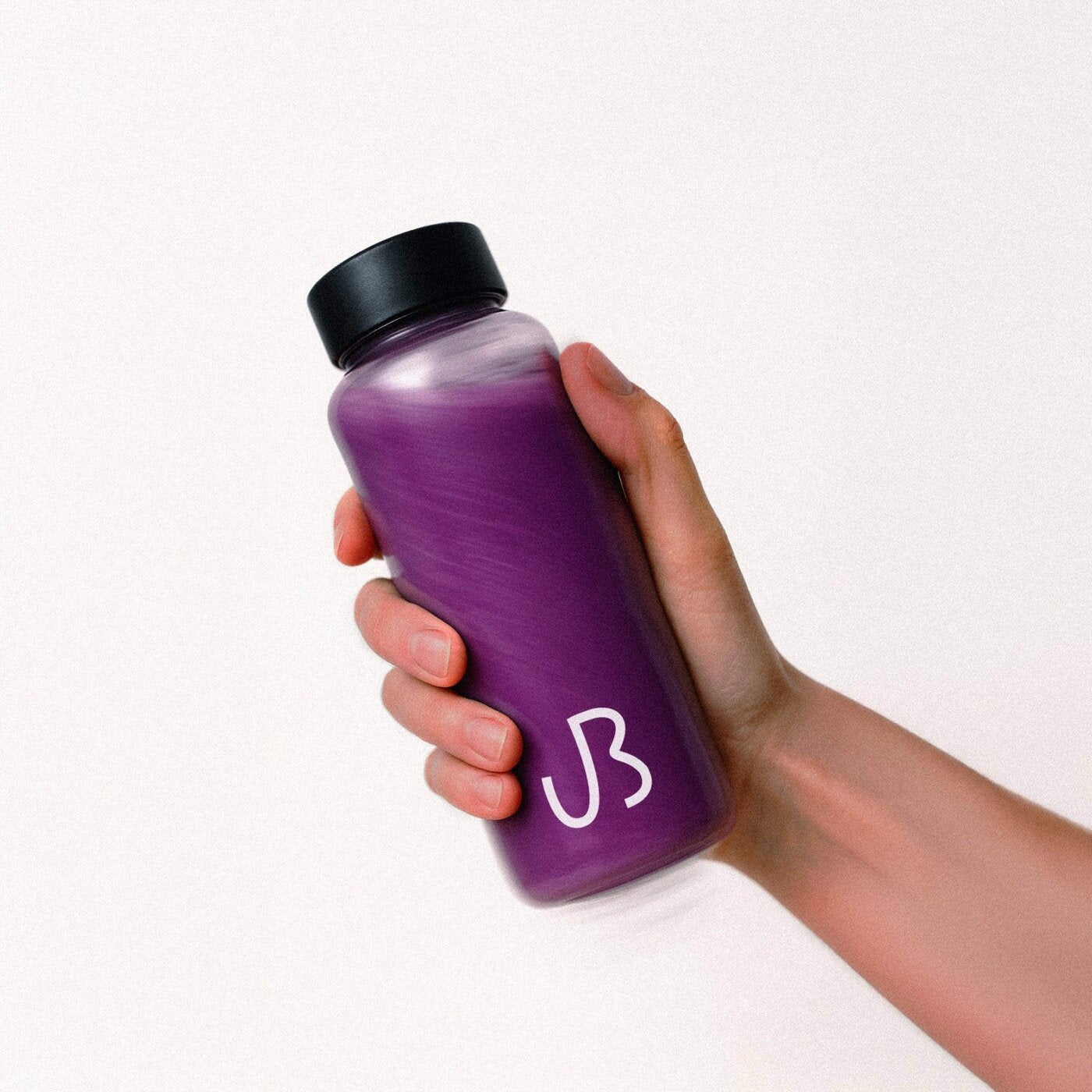 UBurn 500 ml ready-to-drink violet bottle held in hand